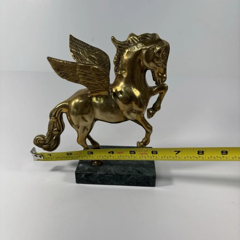 vintage solid brass Pegasus figurine mounted on a green marble base,